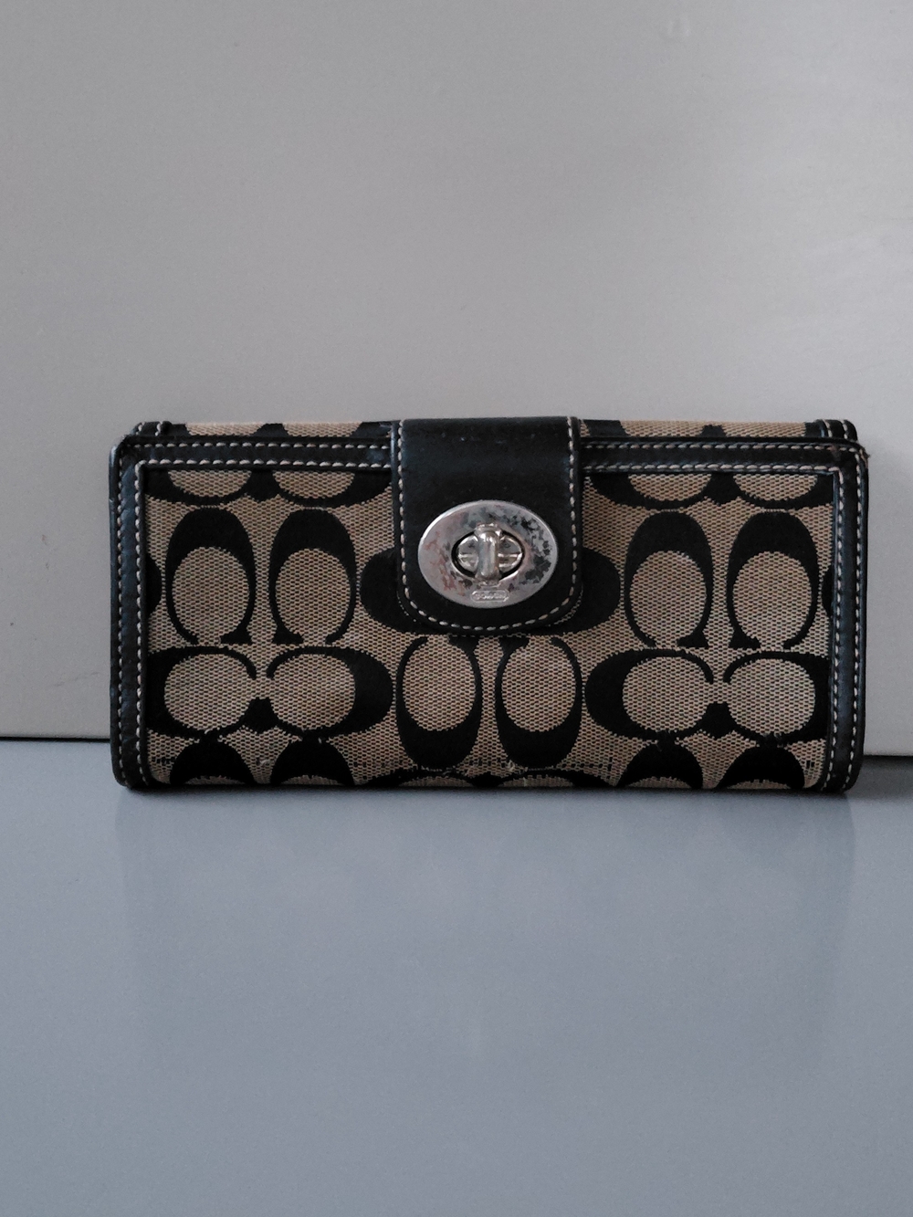 Coach Black and Tan Signature Canvas Turnlock Wallet